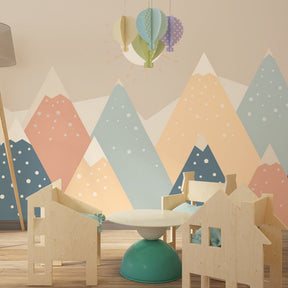 Pastel mountain wallpaper creating serene children's bedroom with Nordic decor style