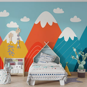 Geometric mountain wallpaper with blue sky and clouds in children's playroom