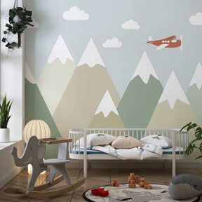 Peaceful mountain peaks mural wallpaper creating calming atmosphere in kids playroom