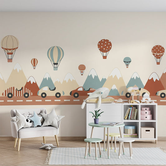 Kids-Mundo striped cars and mountain mural styled in a kids bedroom with balloons above