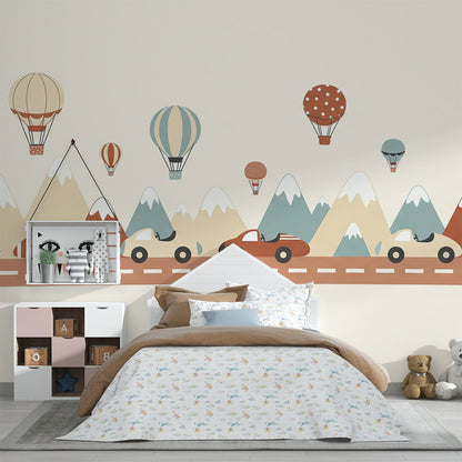 Kids-Mundo mountain road trip wall mural brightening a playroom with airships and balloons