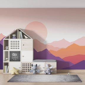 Pink orange mountain landscape wallpaper creating serene kids bedroom atmosphere