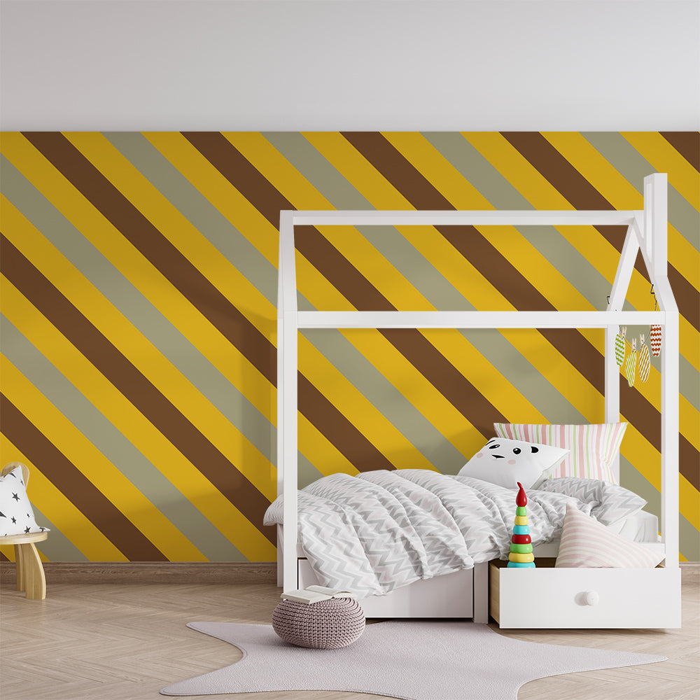 Kids-Mundo bold mustard and sage stripe wall mural behind a bed in a kids bedroom.