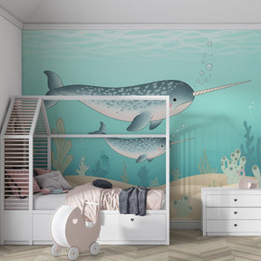 Marine life mural wallpaper with narwhals and coral in children's playroom setting