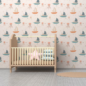 Ocean themed mural wallpaper creating peaceful nursery atmosphere with sailboats and sea creatures