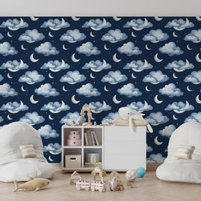 Blue night sky wallpaper with floating clouds and moons for cozy toddler room by Kids-Mundo