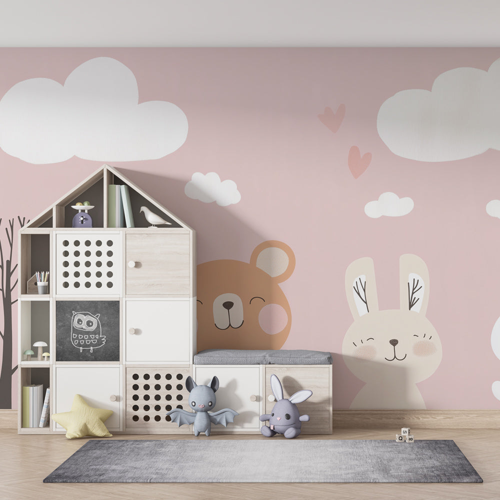 Complete nursery decor featuring pastel mural wallpaper with gentle animals and cloud motifs