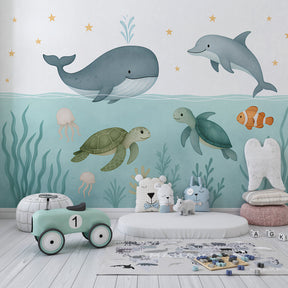 Marine life mural wallpaper creating underwater themed kids bedroom decor