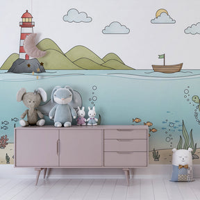 Sea adventure wallpaper with lighthouse and whale in kids playroom by Kids-Mundo