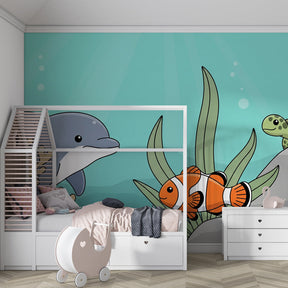Marine life mural wallpaper featuring dolphins and clownfish in bright kids playroom setting