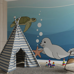 Underwater adventure wallpaper creating calming blue atmosphere in children's bedroom
