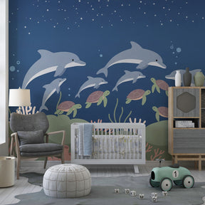 Underwater themed mural wallpaper creating magical ocean atmosphere in kids bedroom