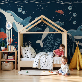 Ocean animals mural wallpaper with dolphins and fish in modern nursery room by Kids-Mundo