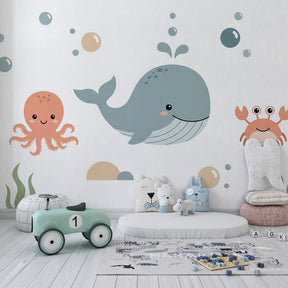 Happy sea creatures wallpaper creating playful underwater theme in children's bedroom
