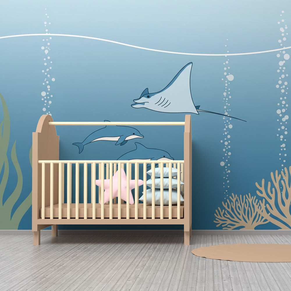 Underwater themed wallpaper creating serene nursery decor with marine life scenes