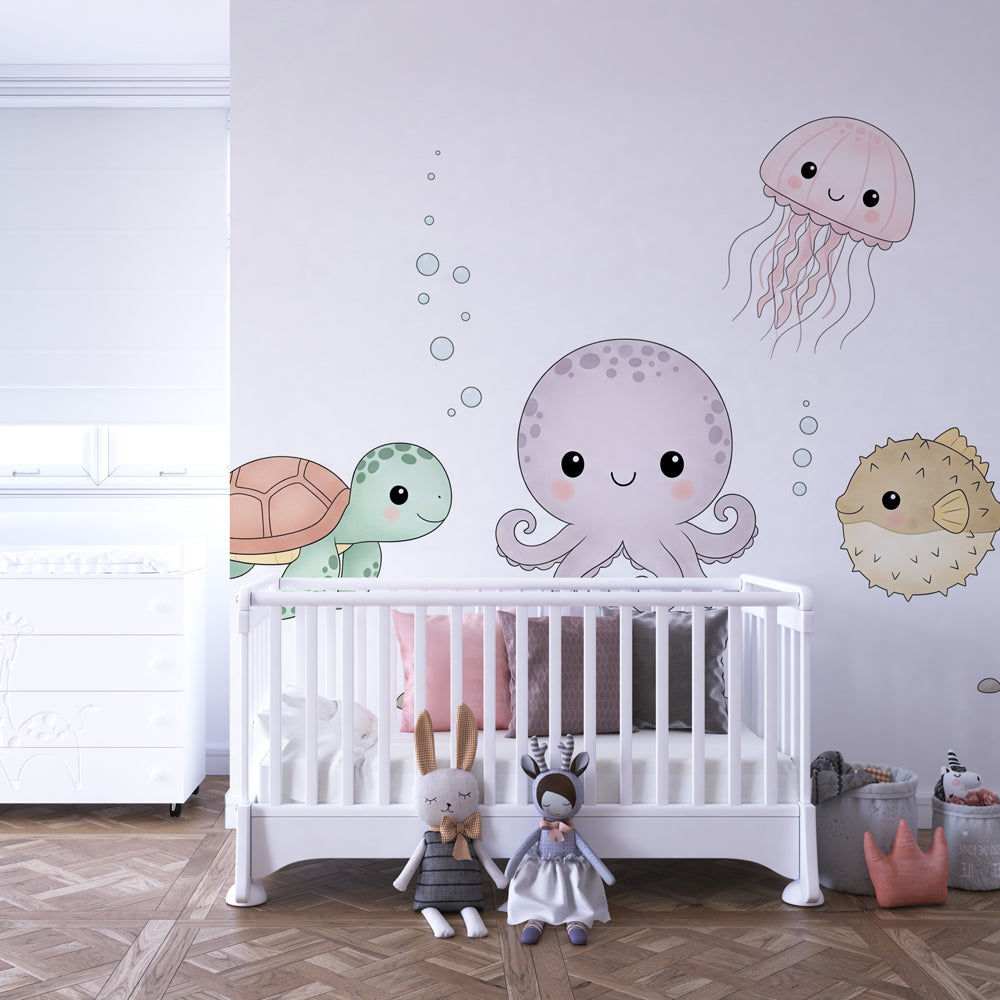 Sea life themed mural wallpaper with jellyfish and pufferfish creating magical playroom atmosphere