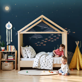 Ocean dolphins mural wallpaper in modern nursery with underwater marine life theme by Kids-Mundo