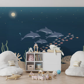 Marine life mural wallpaper with dolphins and colorful fish in children's playroom by Kids-Mundo