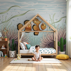 Ocean fish mural wallpaper with clownfish and anemones decorating modern nursery by Kids-Mundo
