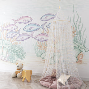 Colorful fish and coral mural wallpaper for kids playroom creating aquatic adventure space
