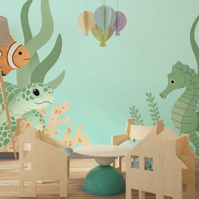 Colorful ocean mural wallpaper with coral and seaweed in kids playroom decor