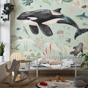 Marine themed mural wallpaper featuring sea creatures in calming kids bedroom setting