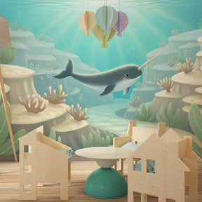 Marine narwal mural wallpaper transforming toddler room into peaceful underwater sanctuary