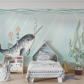 Underwater narwhal wallpaper creating peaceful sleeping environment in children's bedroom