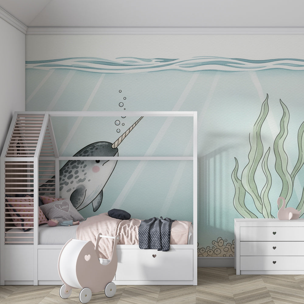 Marine themed narwhal mural wallpaper adding magical ocean atmosphere to kids playroom
