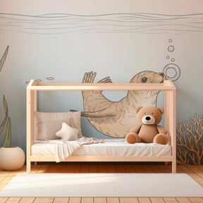Underwater themed mural wallpaper featuring otter and coral for children's playroom