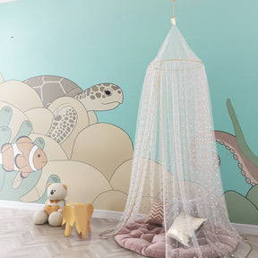 Underwater themed mural wallpaper creating calming kids bedroom decor with marine life