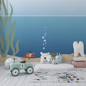 Sea turtle and crab mural wallpaper transforming nursery into underwater sanctuary