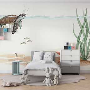 Sea turtle and starfish mural wallpaper transforming baby room into underwater sanctuary