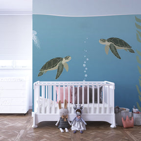 Sea turtle and coral reef wallpaper decorating modern children's bedroom with marine theme