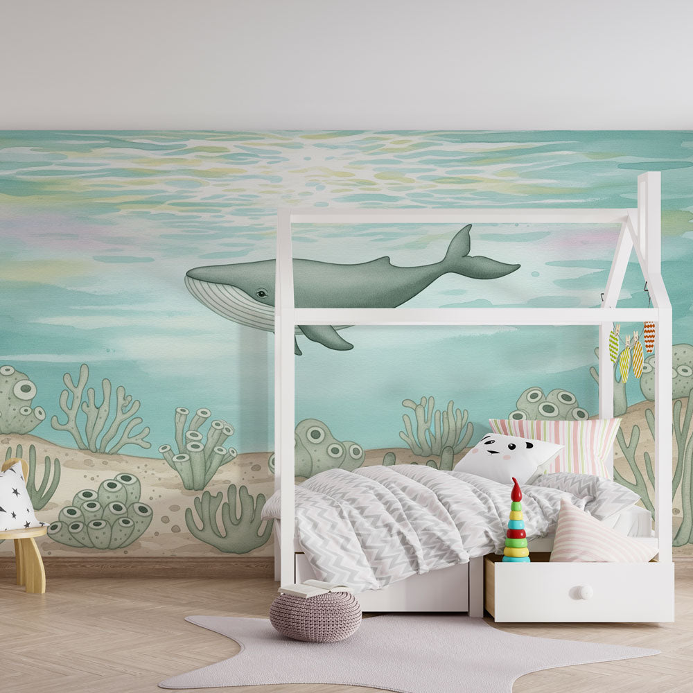 Majestic whale mural wallpaper with marine life creating educational kids playroom decor