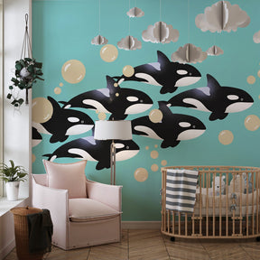 Marine animal mural wallpaper with baby orcas decorating modern children's bedroom by Kids-Mundo