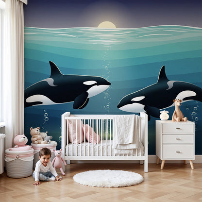 Kids-Mundo two orcas wall mural glowing beneath the surface, shown in a calm nursery setting.