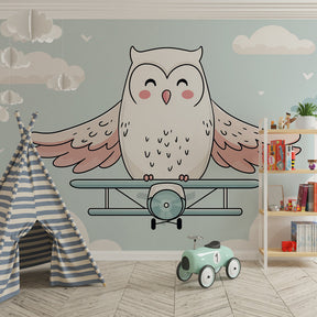 Children's bedroom featuring owl pilot wallpaper with dreamy cloud adventure scene