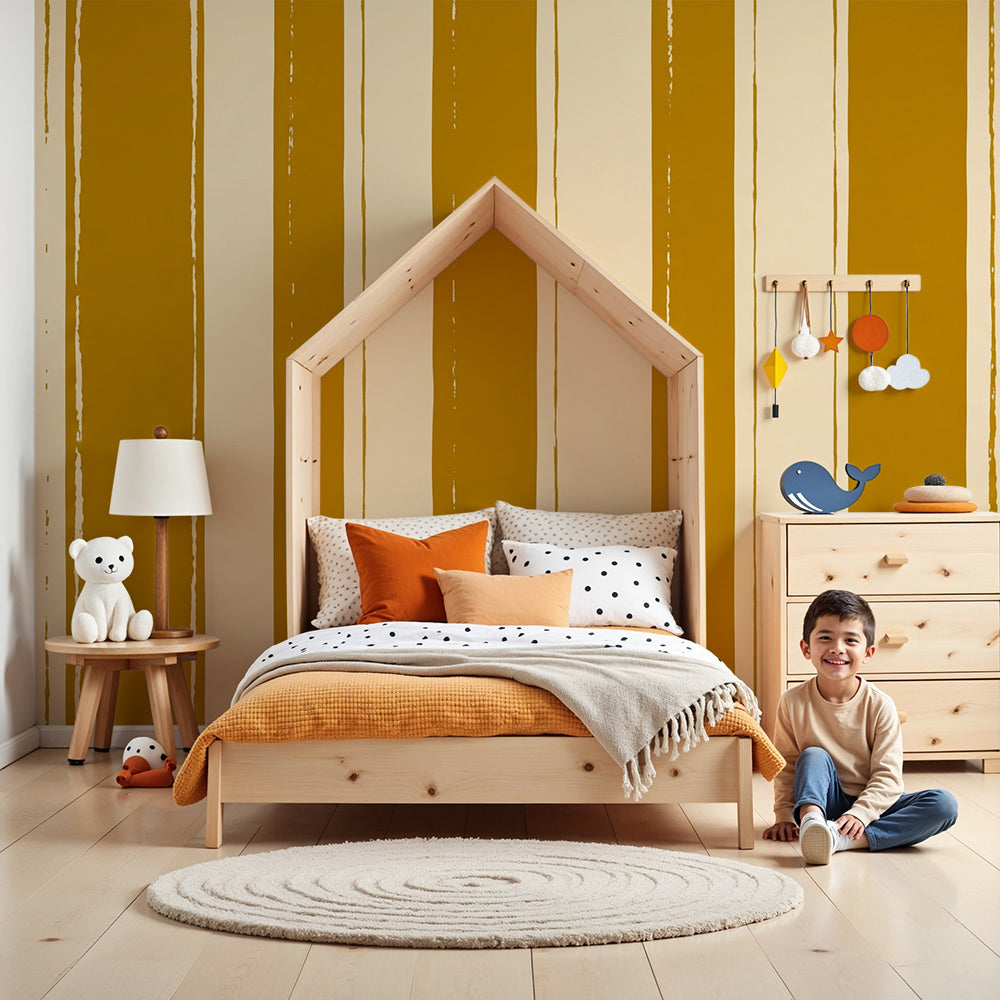 Kids-Mundo mustard painted stripe wall mural in a bright, airy nursery