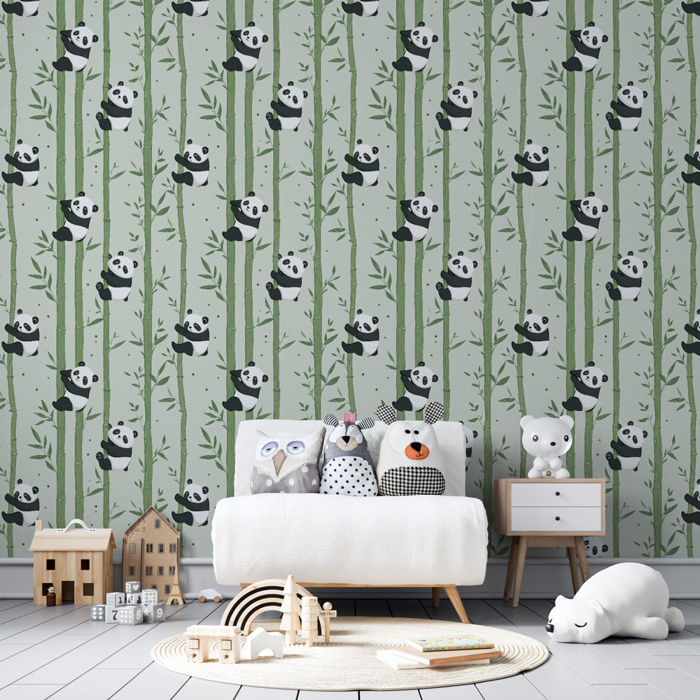 Kids-Mundo panda bamboo pattern wall mural behind a single bed in a modern kids' bedroom with green cushions.