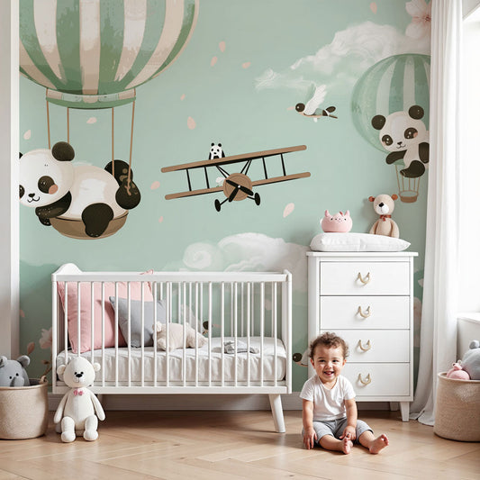 Kids-Mundo panda hot air balloon wall mural styled in a soft sage-green nursery