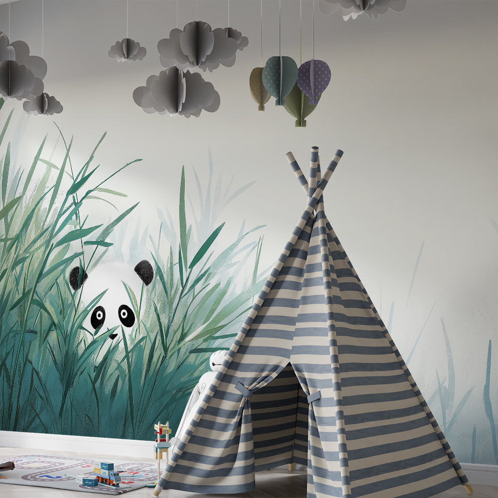 Kids-Mundo panda peeking through bamboo leaves mural covering a playroom wall behind toy shelves