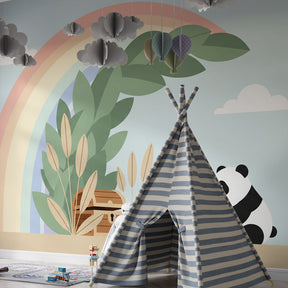 Whimsical panda nursery wallpaper with rainbow and treasure chest in peaceful baby room setting