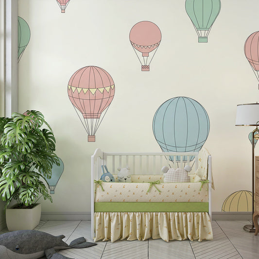 Kids-Mundo balloon pattern wall mural behind a bed in a soft pastel kids bedroom