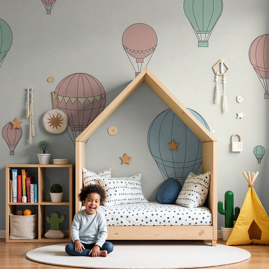Kids-Mundo pastel hot air balloon wall mural in a calm, neutral nursery with a cot