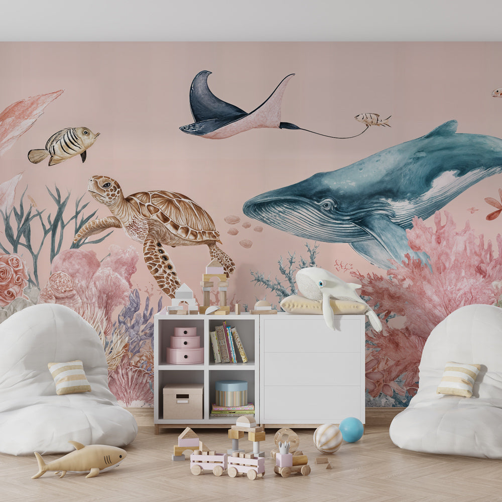 Kids-Mundo underwater wall mural styled in a playroom, featuring a whale, turtle, ray and pastel coral reef.