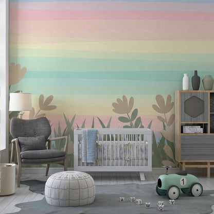 Kids-Mundo rainbow sky and wildflower wall mural behind a bed in a soft kids bedroom