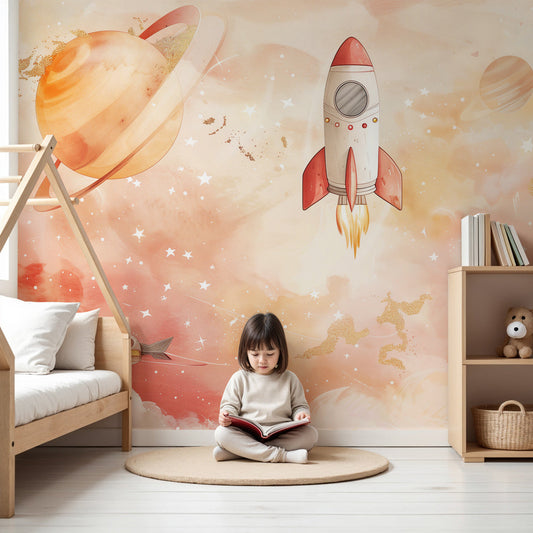 Kids-Mundo watercolour rocket wall mural in a pastel nursery, with clouds and a ringed planet above the crib