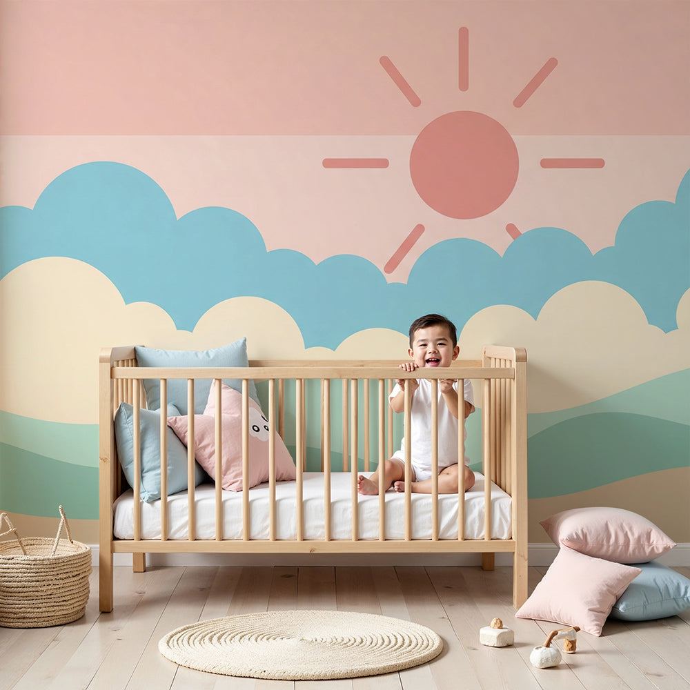 Kids-Mundo pastel sky wall mural styled behind a cot in a soft, sunlit nursery setting