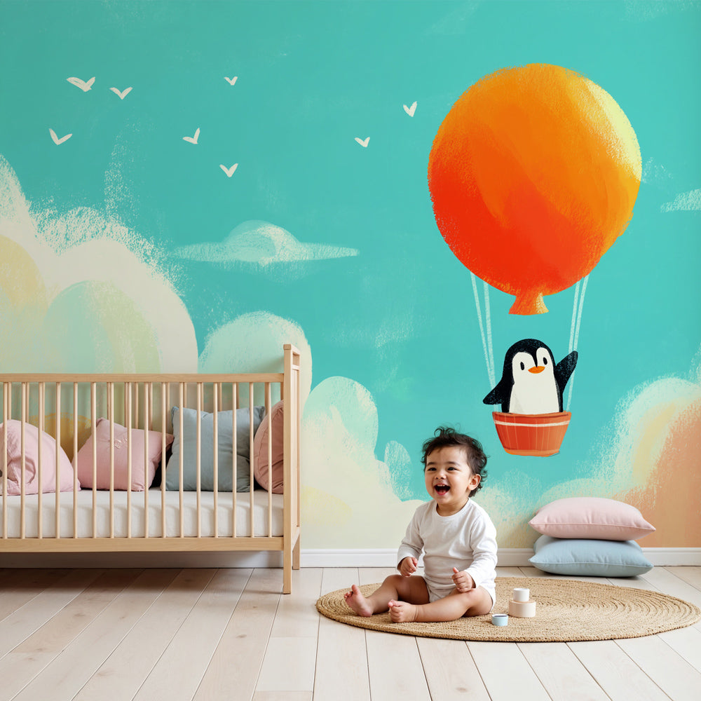 Penguin hot air balloon mural wallpaper in modern nursery with natural wood furniture by Kids-Mundo